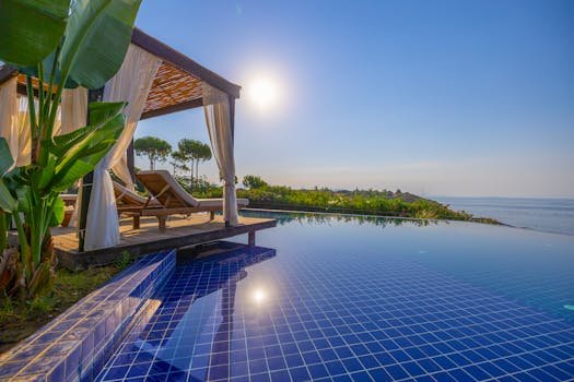 Relaxing poolside cabana overlooking the sea in Didim, Türkiye, perfect for a luxury getaway.